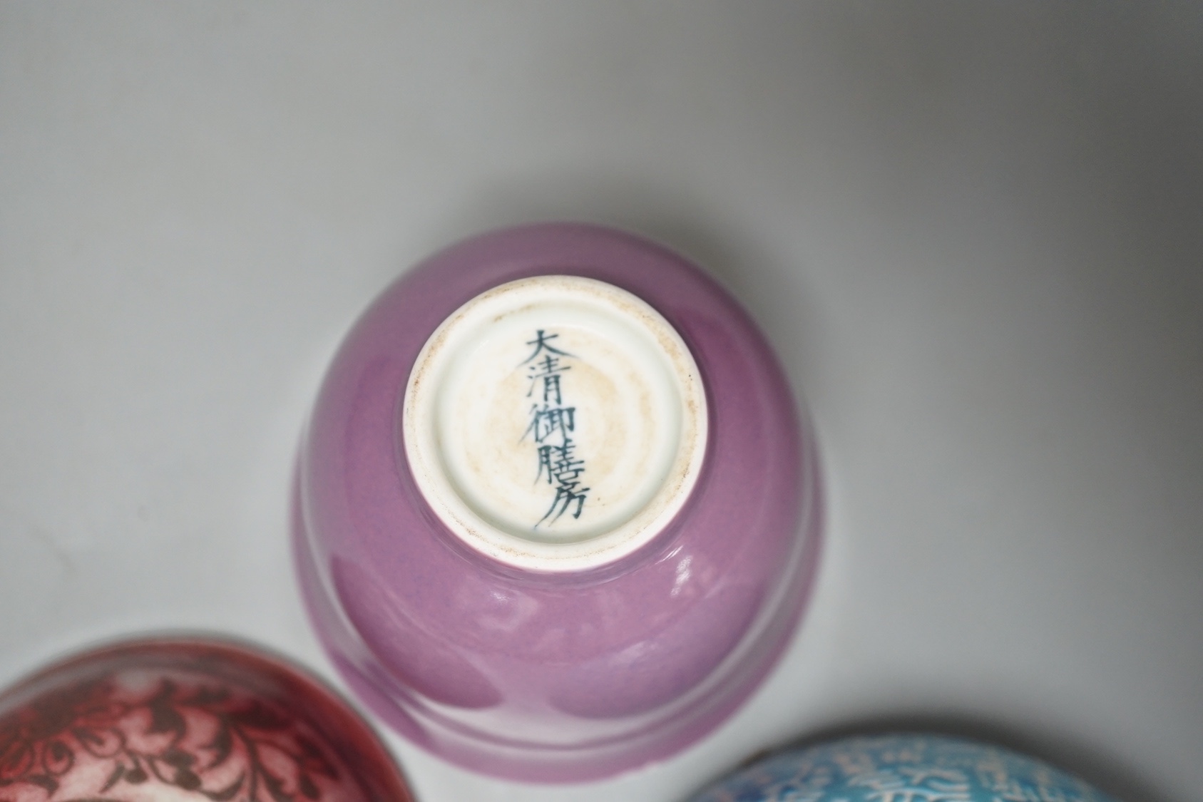 A Chinese copper red glazed bowl and two others